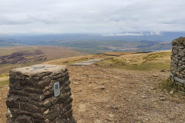 Pen-y-ghent Summit Trig Point looking down Ribblesdale.